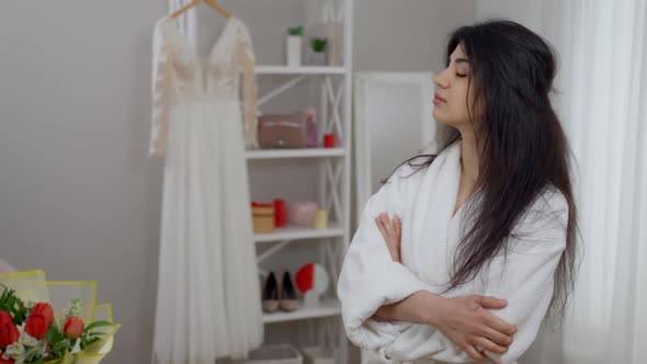 Frustrated Depressed Middle Eastern Beautiful Bride Looking Back at Wedding Dress Turning to Camera alt