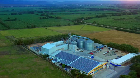 Agricultural land with rice storage silos. Aerial backward by BlackBoxGuild