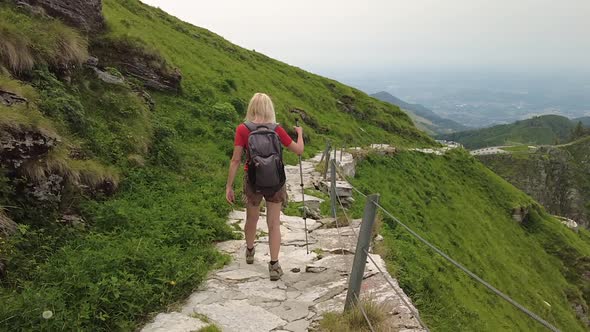 Tourist Woman Trekking on Monte Generoso alt