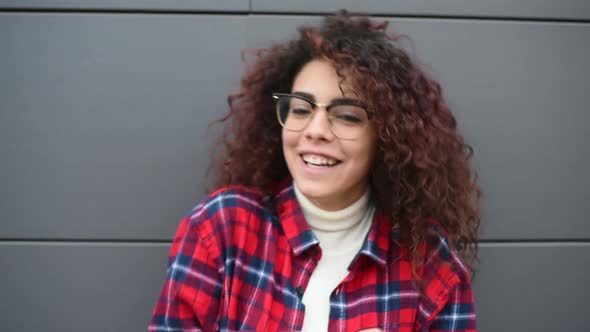 full hd young woman using smart phone outdoor smiling alt