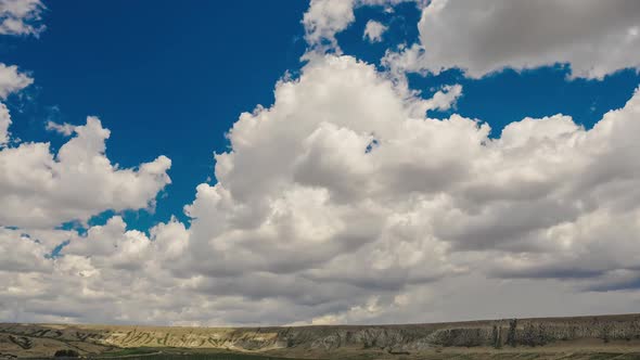 Aerial View of the Klementyev Mountain in Koktebel Under Dense Beautiful Clouds in Sunny Weather alt