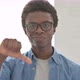 Portrait of Young African Man Showing Thumbs Down - VideoHive Item for Sale