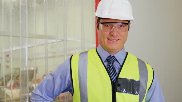 Portrait of inspection officer holding clipboard alt