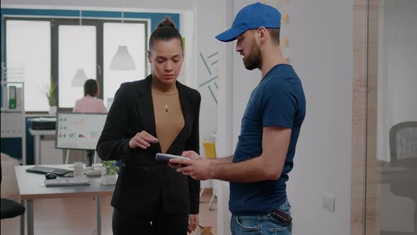 Delivery Man Bringing Takeaway Lunch Meal Holding Delivery Box at Startup Business Company alt