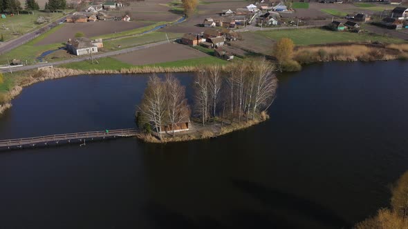 Aerial View of the Small Wooden House on the Island 