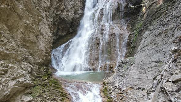 Margaret Falls cascading down a rocky mountain in the beautiful, lush Herald Provincial Park located alt