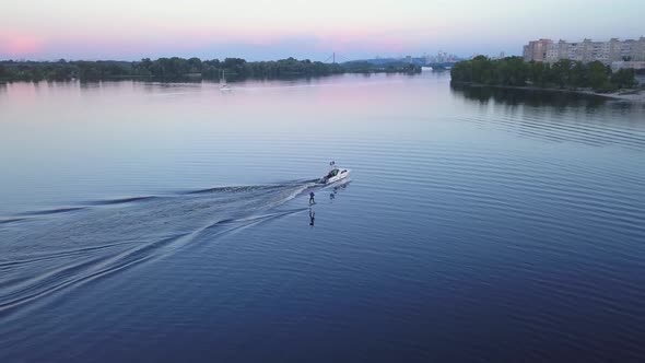 Aerial Photography Wakeboarding Wakeboarding Behind a Boat at Sunset Top View Against the Background