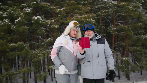 Entertainment for Pensioners an Elderly Man and Woman in Warm Clothes Rest in the Winter Forest and
