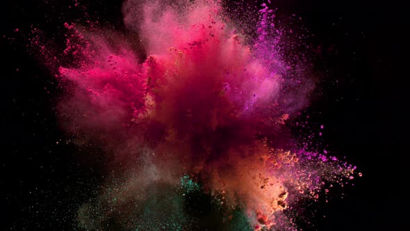 Super Slowmotion Shot of Color Powder Explosion Isolated on Black Background alt