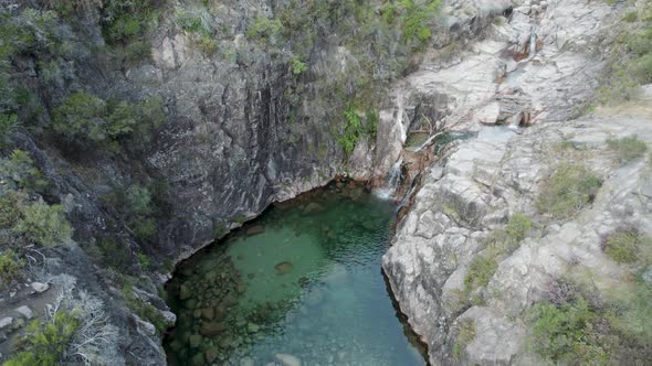 Aerial tilt down over waterfall Portela Do Homem. National Park Peneda-Gerês, Portugal