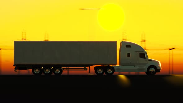 Silhouette of the semi truck with trailer driving on the street during dusk. alt