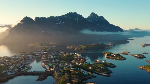 Flight over the sea and view on the fishing village Henningsvaer ,Lofoten Islands,Norway