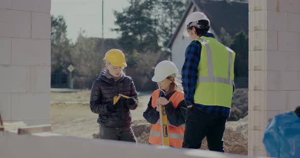 Confident Female Engineer Explaining While Discussing with Workers alt
