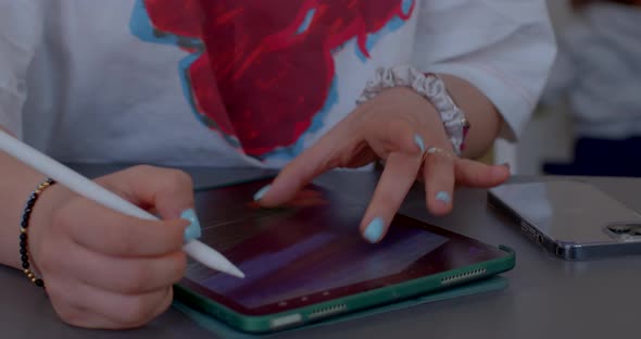 Closeup Women Hands with Jewelry on Wrists and Manicure with Blue Nail Polish alt