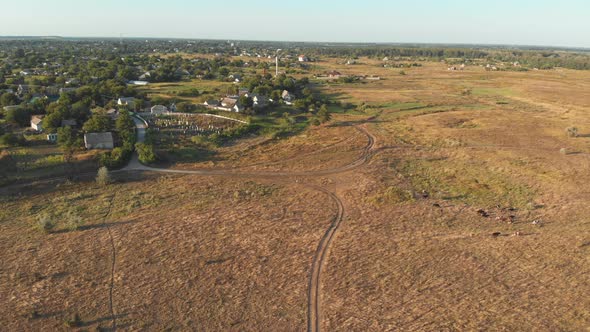  Aerial View of the Countryside and Small Village with Green Fields and Meadows alt