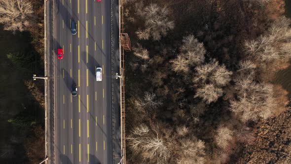 City Traffic on the Bridge at the Winter Without Snow. Top View