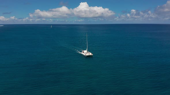 Catamaran in Turquoise Water Against the Background of the Paradise Island Mauritius alt