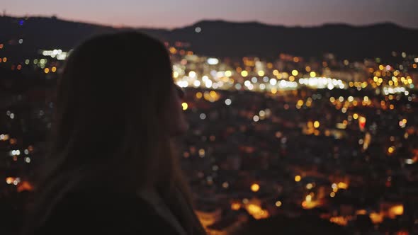 Close Up Portrait of Young Woman Looking at Night City Lights Enjoying Glowing Cityview Late in alt