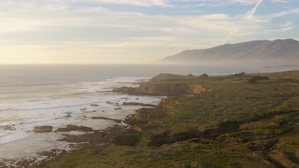 Rocky coastline on the island. Drone Over Coastline Cliffs And Sea.  alt