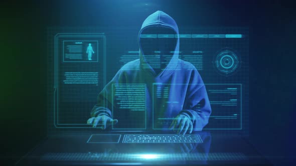 Cybercriminal Hacker in a Mask Enters Text on the Keyboard alt