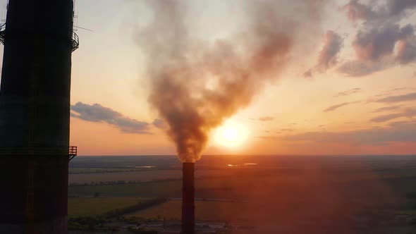Aerial View. Industrial Pipe Pollute the Air Next To People Living in the City alt
