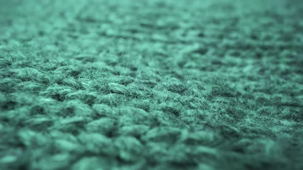Extreme Detail View of Sheep Wool Cloth Texture Flowing in Macro Dolly Shot alt