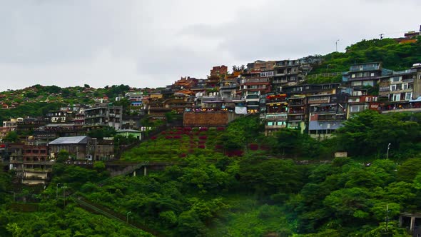 time lapse of Jiufen village with mountain in raining day, Taiwan