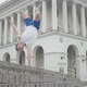 Wide Shot of Confident Break Dancer Moving Legs Up As Standing on One Hand. Portrait of Athletic - VideoHive Item for Sale