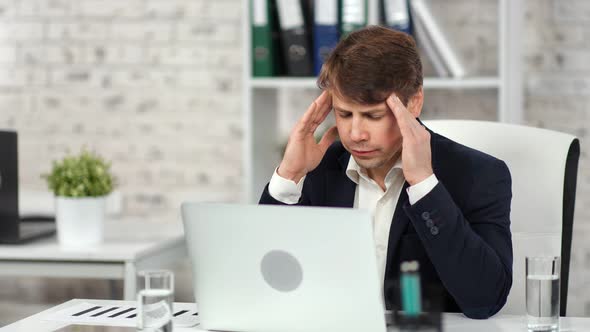 Male Boss Having Headache Massaging Temple Feeling Discomfort at ...