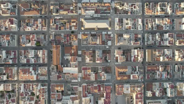 Aerial topdown view Along Symmetrical urban grid towards Vila Real de Santo Antonio marina in Portug alt