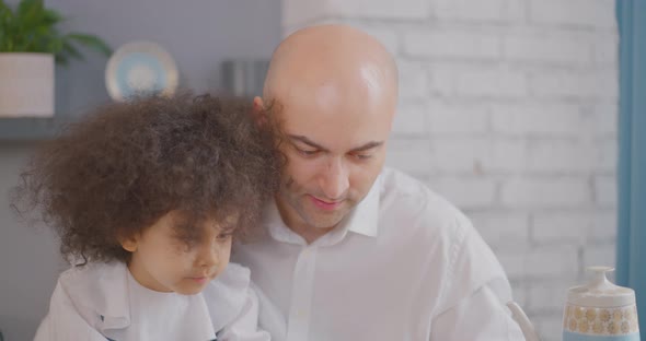 Father is playing with his daughter Dad and daughter are resting at home  Turkish family alt