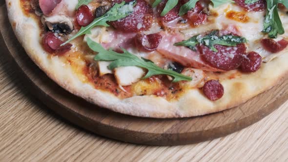 Appetizing Pizza on a Wooden Board in a Restaurant alt