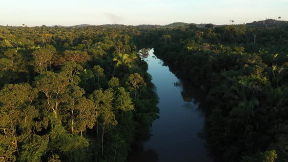 Drone Rising From A Riverbed, In The Middle Of The Amazon Rainforest, 4K