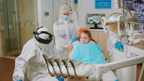 Child with Ppe Suit Taking Care of Dental Health During Coronavirus Pandemic alt
