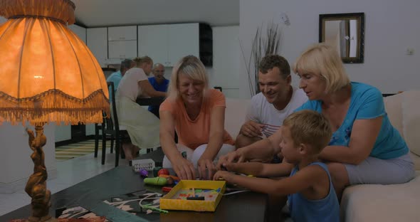 Child spending leisure time with dad and grandmothers alt