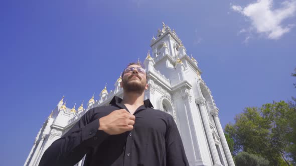 Pilgrimage sign in front of christian church. alt