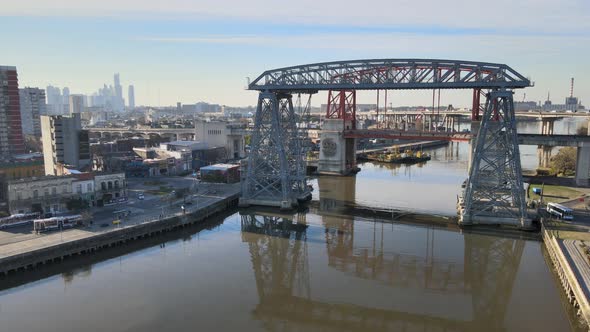 Drone hovering above Matanza river on a sunny day facing the famous historical monument bridge Puent alt