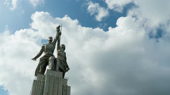 Worker and Kolkhoz Woman in Front of Passing Clouds