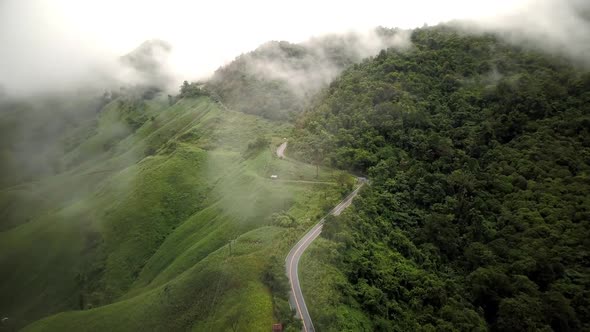 Countryside Road Passing Through The Mountain Landscape  alt