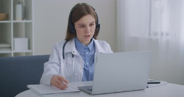 Online Appointment with Therapist, Woman Is Sitting at Office in Clinic and Consulting People alt