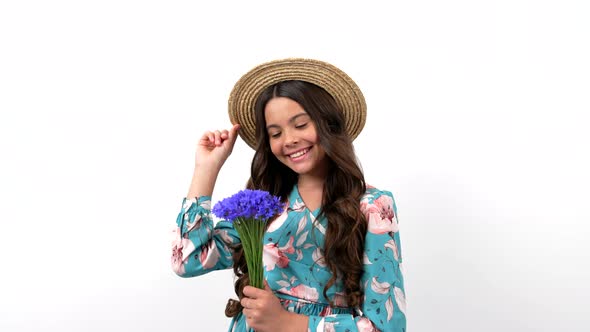 Cheerful Child in Summer Straw Hat Hold Wildflower Flower Bouquet Smell Centaurea Beauty