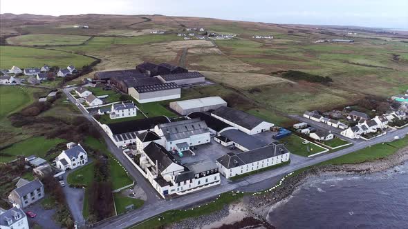 Aerial of a Distillery in Islay Scotland alt