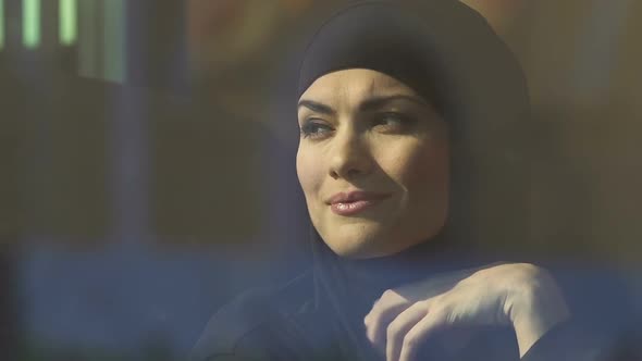 Happy Muslim Woman Looking Out Through Window, Successful Life, Equal Rights alt