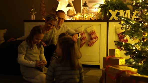 Children Opening Christmas Presents