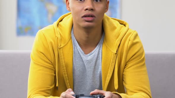 Happy Afro-American School Boy Winning in Video Game, Leisure, Teenage Lifestyle alt