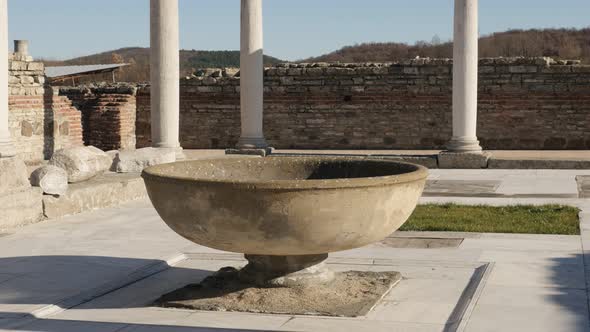 GAMZIGRAD, SERBIA - DECEMBER 25, 2017 Ancient fountain inside  imperial palace Felix Romuliana built alt