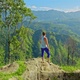 Female Hiker Standing on Top of the Mountain and Enjoying Valley View at Sunrise, Ella, Sri Lanka - VideoHive Item for Sale