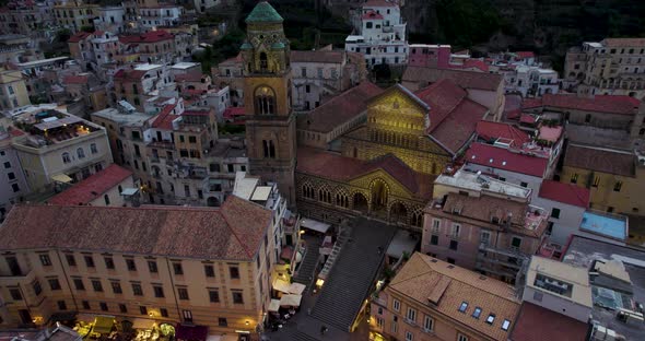 Twilight drone view over medieval Roman Catholic Amalfi Cathedral, Italy alt