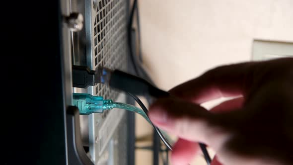 Connect devices to the desktop system unit. Hand inserts device plugs alt