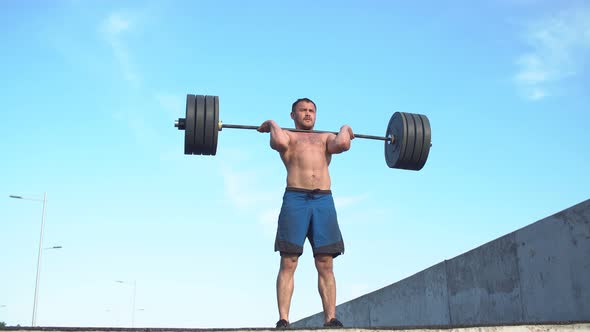 Athlete Training with Barbell